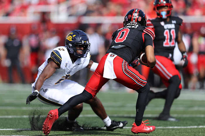 Oct 14, 2023; Salt Lake City, Utah, USA; California Golden Bears defensive back Craig Woodson (2) tackles Utah Utes wide receiver Mikey Matthews (0) in the second quarter at Rice-Eccles Stadium. Mandatory Credit: Rob Gray-USA TODAY Sports